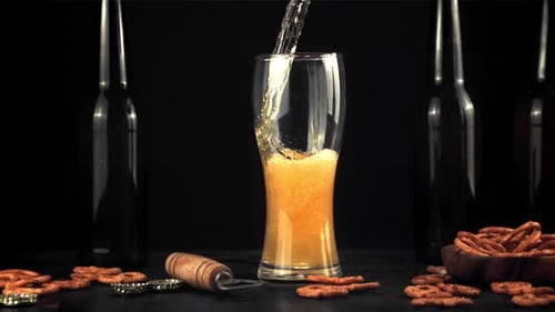 Beer Pouring Into Glass with Bubbles