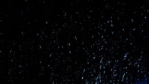 Rain Drops on a Window at Night
