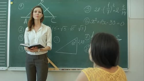 Teacher Asking Her Students a Question at the Elementary School