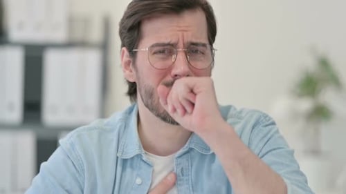 Man Coughing in Office Close Up