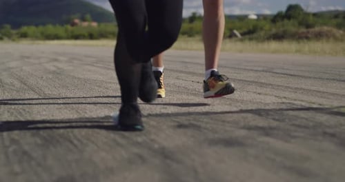 Legs Close Up Slow Motion Fit Couple Jogging Exercising Running Cardio Workout