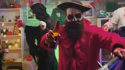 Halloween Party with Dancing People in Costumes