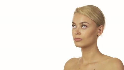 Close Up of a Young Woman Against White