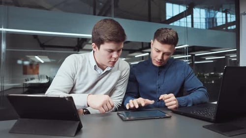 Business Meeting With Tablet Technology in Modern Office