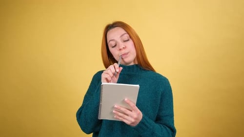 Young Red Hair Woman Posing Isolated on Yellow Color Background Studio