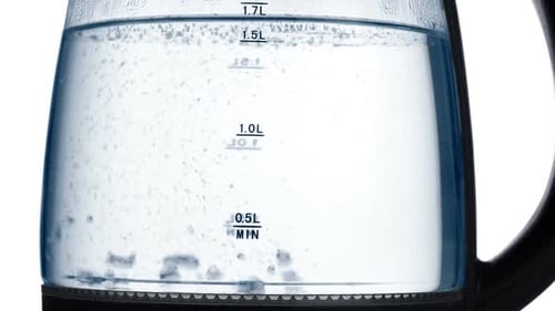 Water Boiling in Clear Electric Kettle Close Up
