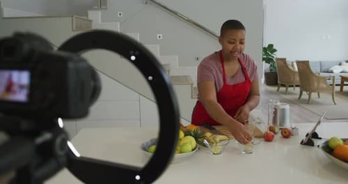 Woman Chopping Fruit for Healthy Recipe at Home