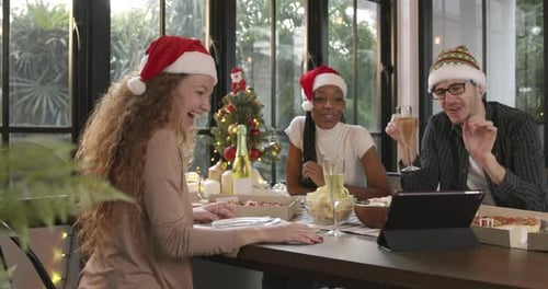 Friends Toasting Champagne on Video Conference at Christmas