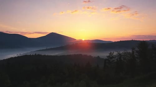 Mountains and Forest at a Beautiful Sunrise