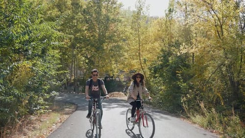 Happy Couple Riding Bicycles Outdoors