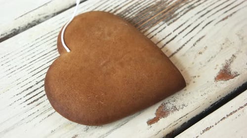 Decorating Heart Shaped Cookie With White Icing