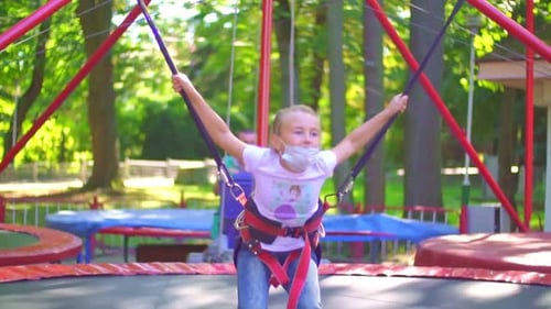 Girl Jumping on a Trampoline