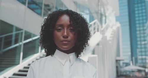 Stylish Woman Posing Confidently in Urban Setting