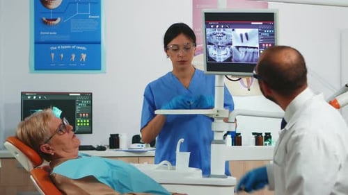 Woman Examined by Dentists in Dental Office
