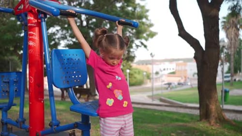 Active Little Girl Child Trains on Simulator City Park