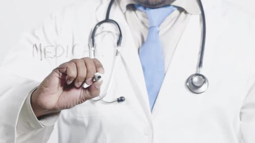 Medical Professional Writing Medical Tourism on Glass