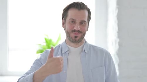 Man Gives Thumbs Up Sign of Approval