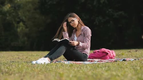 Girl Reads in Park