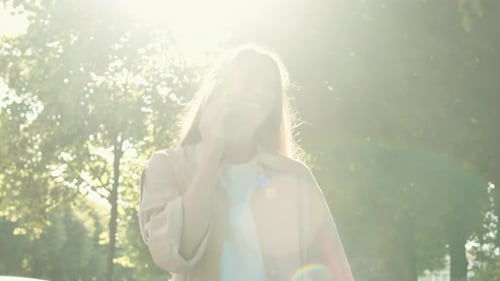 Woman Talking on Phone in Park