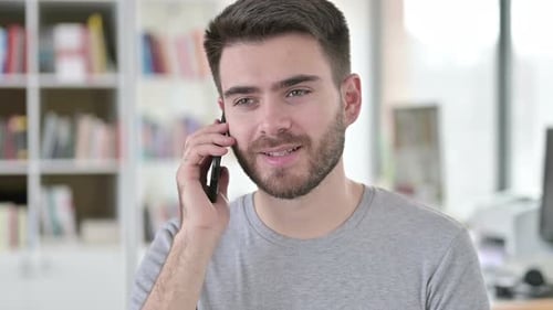Young Man Talking on Mobile Phone, Close Up