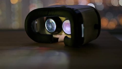 Virtual Reality Headset Reflecting Night City Lights