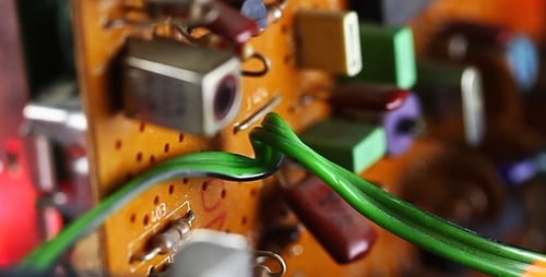 Close Up of Electronic Circuit Board with Bokeh Lights