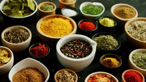 Assortment of Colorful Spices and Herbs in Bowls