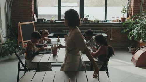 Children Learning Pottery Art in Studio with Teacher