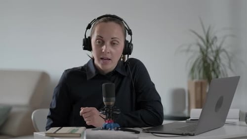 Woman Speaking into Microphone at Home Office