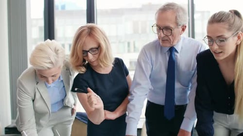 Team of Colleagues Collaborating on Sustainable Energy Project