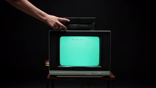 Old Retro Square Television with Blue Screen on Black Background