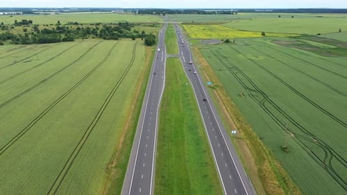 Asphalt Highway Through Green Summer Field