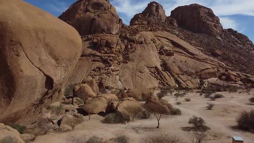 Massive round rocks and huge mountains, Erongo, Namibia, aerial shot