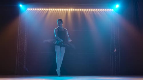 Elegant Ballerina Dancing Gracefully on Stage