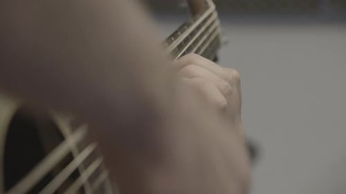 Hands playing the guitar