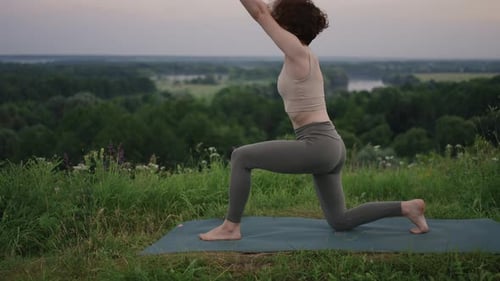 Woman Practices Yoga for Health and Fitness
