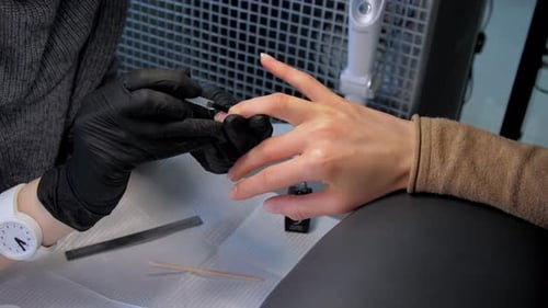 Young Woman Changes Hands in Ultraviolet Lamp Drying