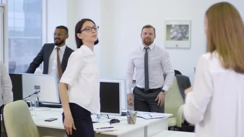 Office Workers Stretching During Wellness Break
