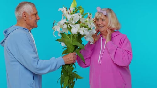 Romantic Senior Couple with White Lily Bouquet