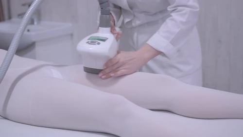 Woman Receiving Body Massage Procedure in Medical Spa