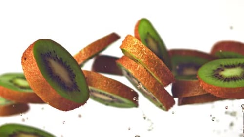 Super Slow Motion Kiwi Pieces Rise Up with Drops of Water