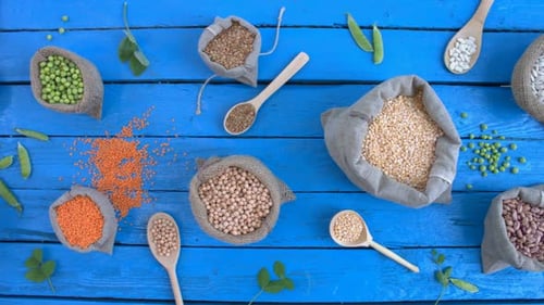 Assorted Dried Beans and Grains with Wooden Spoons