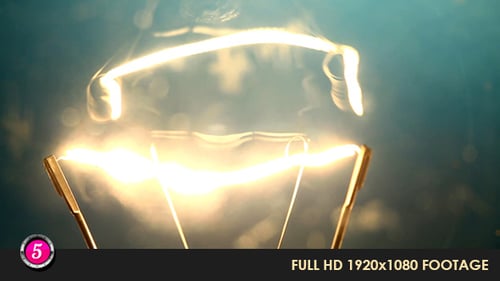 Glowing Filament in Bright Light Bulb Close Up