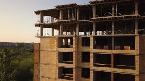 Aerial view of tall residential apartment buildings under construction.