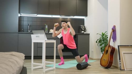Man Does Lunges with Weights at Home