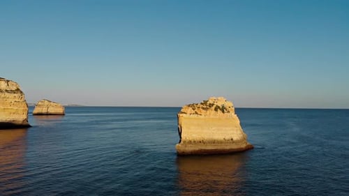 Drone in over cliff on sunset