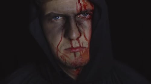 Scary Man With Bloody Makeup in Hooded Cloak