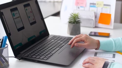 Designer with User Interface on Laptop at Office 17