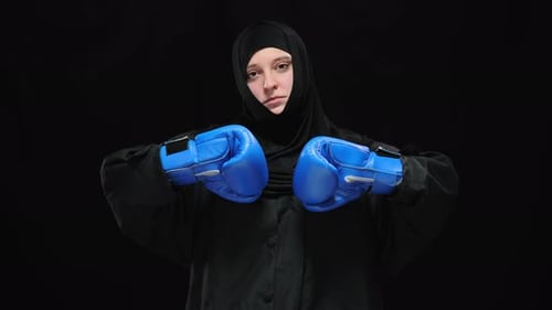 Young Adult with Boxing Gloves Ready to Box