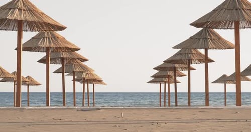 Beach Umbrellas on a Beach at Sunset